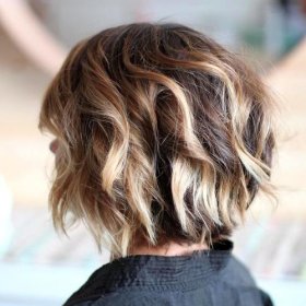 choppy chin-length bob with blonde highlights